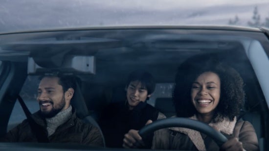 Three passengers riding in a vehicle and smiling | Hubler Nissan in Indianapolis IN