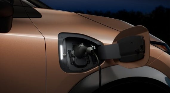 Close-up image of charging cable plugged in | Hubler Nissan in Indianapolis IN
